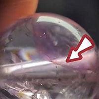 Natural Amethyst sphere with natural internal fracture and cloud inclusion, identification reference to tell genuine Amethyst apart from synthetic & dyed fake crystal beads